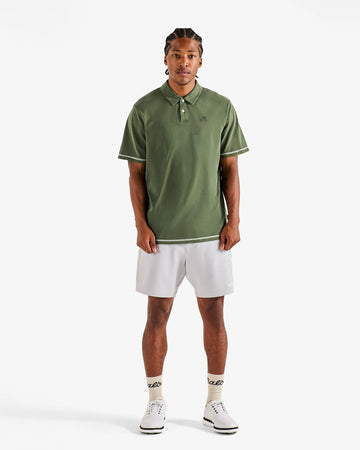 Malbon Fairway Overdyed Polo - Rifle Green on model front