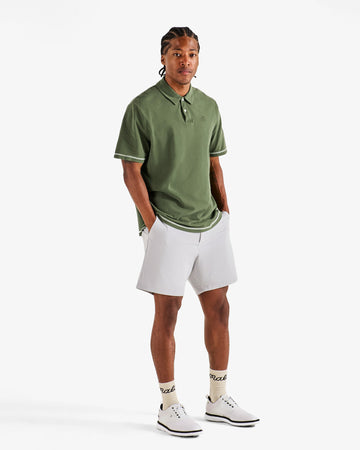 Malbon Fairway Overdyed Polo - Rifle Green on model side