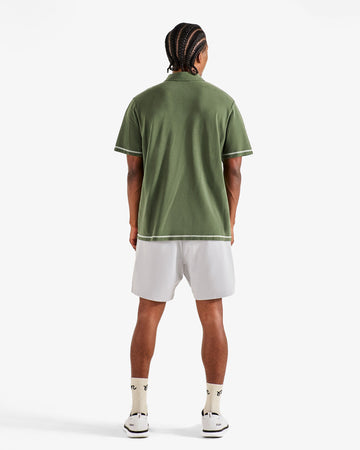 Malbon Fairway Overdyed Polo - Rifle Green on model back